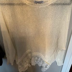 Cream sweater with lace on bottom